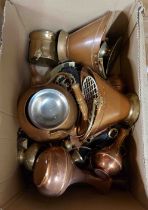 A box containing a quantity of copper and brassware including copper kettle, horse brass on leather,