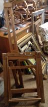 Two modern mixed wood folding artist's easels - sold with a smaller similar