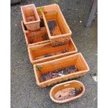 Six rectangular planters - sold with one smaller similar and a circular planter