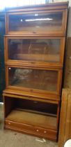 An 86cm early 20th Century Globe Wernicke light oak four section modular bookcase with cornice and