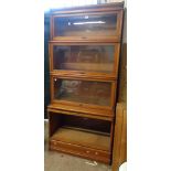 An 86cm early 20th Century Globe Wernicke light oak four section modular bookcase with cornice and