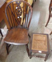 An antique yew wheelback standard chair with moulded solid elm seat, set on ring turned supports