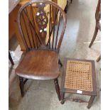 An antique yew wheelback standard chair with moulded solid elm seat, set on ring turned supports