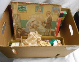 A box containing a quantity of vintage games, a victory puzzle, a Pelham puppet and one other