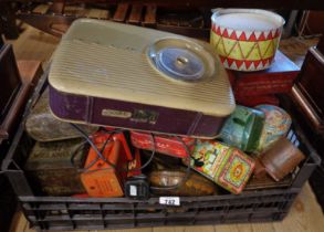 A crate containing vintage tins - sold with a vintage Bosch radio