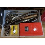 A box containing vintage garage automobilia