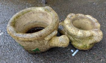 A large concrete planter in the form of a watering can - sold with another in the form of a boot