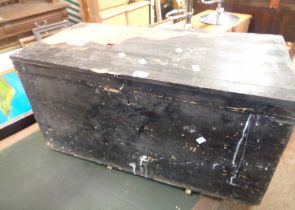 An 84cm old black painted pine lift-top box with flanking iron drop handles
