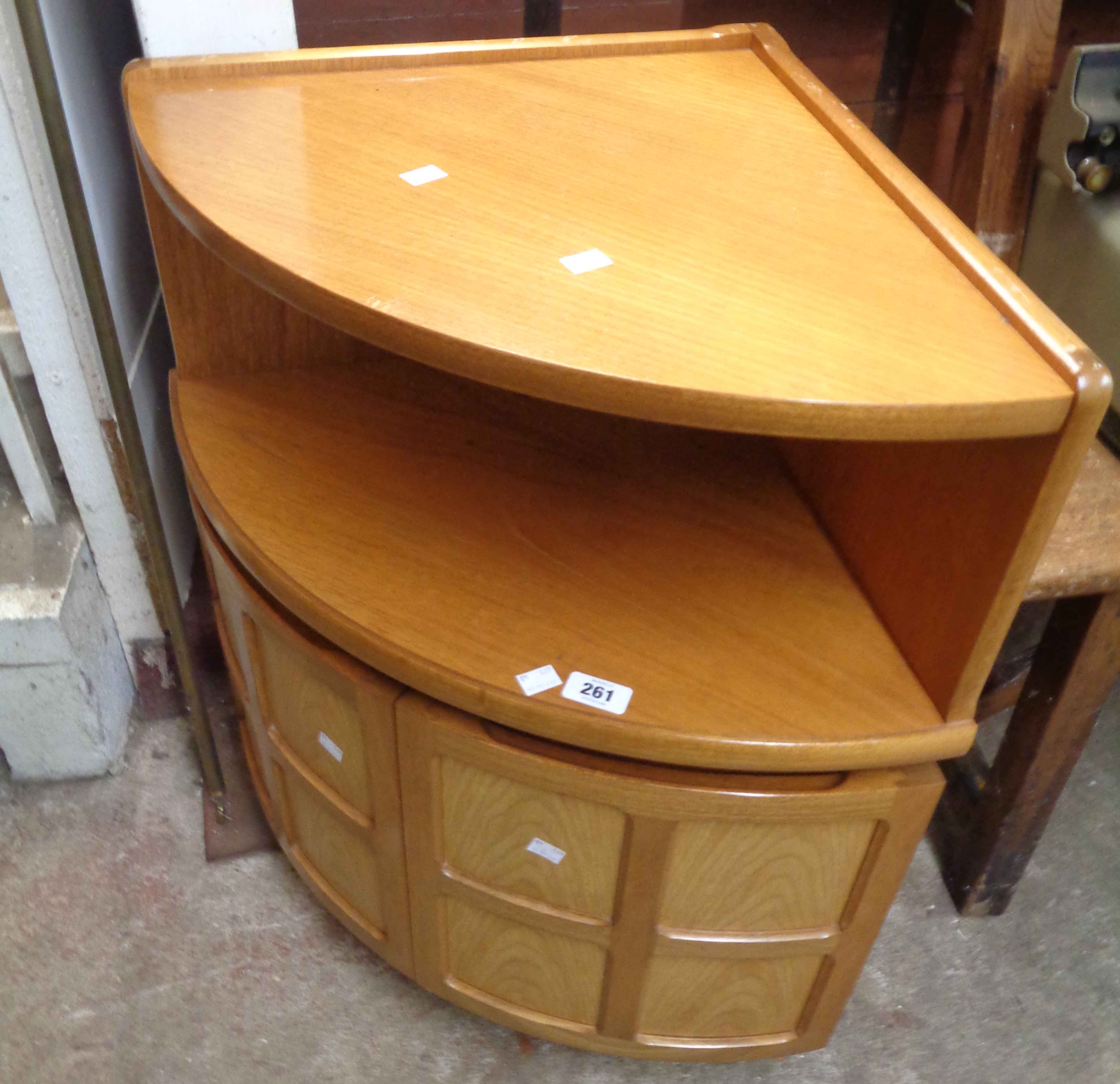 A 62cm retro Nathan Furniture teak effect corner unit with recess and double panelled cupboard