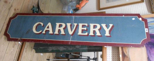 A vintage railway 'Carvery' sign with gloss red border and shadowing to the white transfer letters