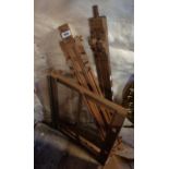 Two wooden artists' easels and another similar