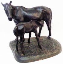 A vintage Russian black painted cast iron figurine, depicting a mare and foal - stamped to base