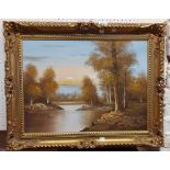 †Chapman: an ornate gilt framed oil on canvas, depicting a woodland river landscape at sunset -