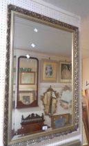 A gilt framed bevelled oblong wall mirror - border rubbed