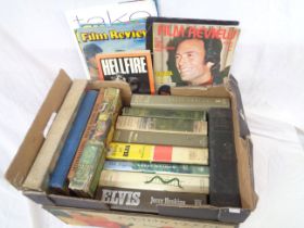 A box containing a selection of assorted hardback books including Rock-n-Roll interest, Dirk Bogarde