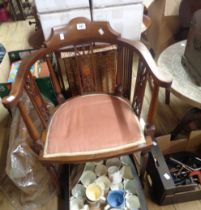 An Edwardian mahogany and strung framed bow elbow chair with upholstered seat panel, set on turned