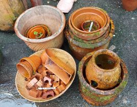A small quantity of terracotta pots and pot risers