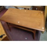 A 1.18m mid 20th Century Danish teak coffee table with moulded edge, set on moulded supports with