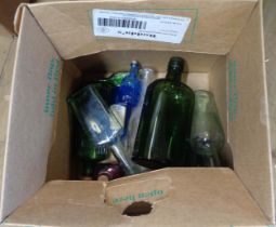 A small box containing a quantity of old glass bottles including Gordons gin bottle