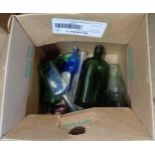 A small box containing a quantity of old glass bottles including Gordons gin bottle