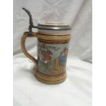 A vintage Villeroy & Boch Mettlach tankard with medieval style frieze decoration and cast metal