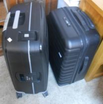 Two modern Samsonite wheeled suitcases