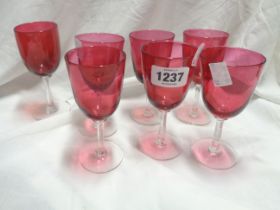 A set of six Edwardian cranberry glass bowl drinking glasses - sold with another similar