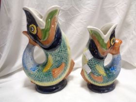 Two Dartmouth pottery gurgle jugs of fish form, each with a multicoloured painted finish - various