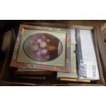 A box containing a large quantity of pictures and picture frames