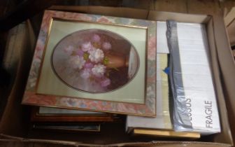 A box containing a large quantity of pictures and picture frames