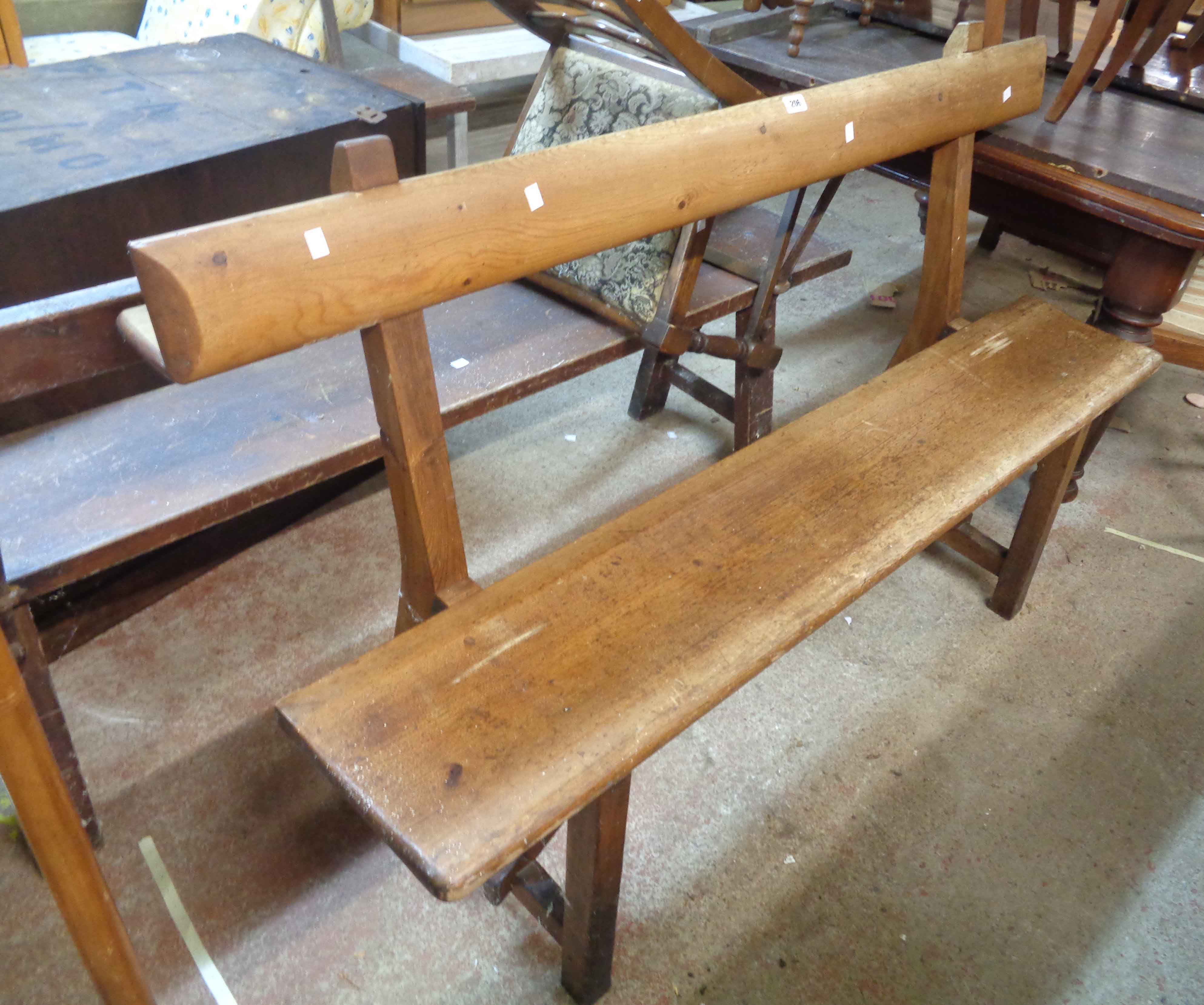 A 1.52m Victorian pine form style chapel pew with book rest to back and moulded solid seat, set on