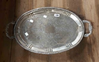 A silver plated two handled tray with chased decoration