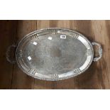 A silver plated two handled tray with chased decoration