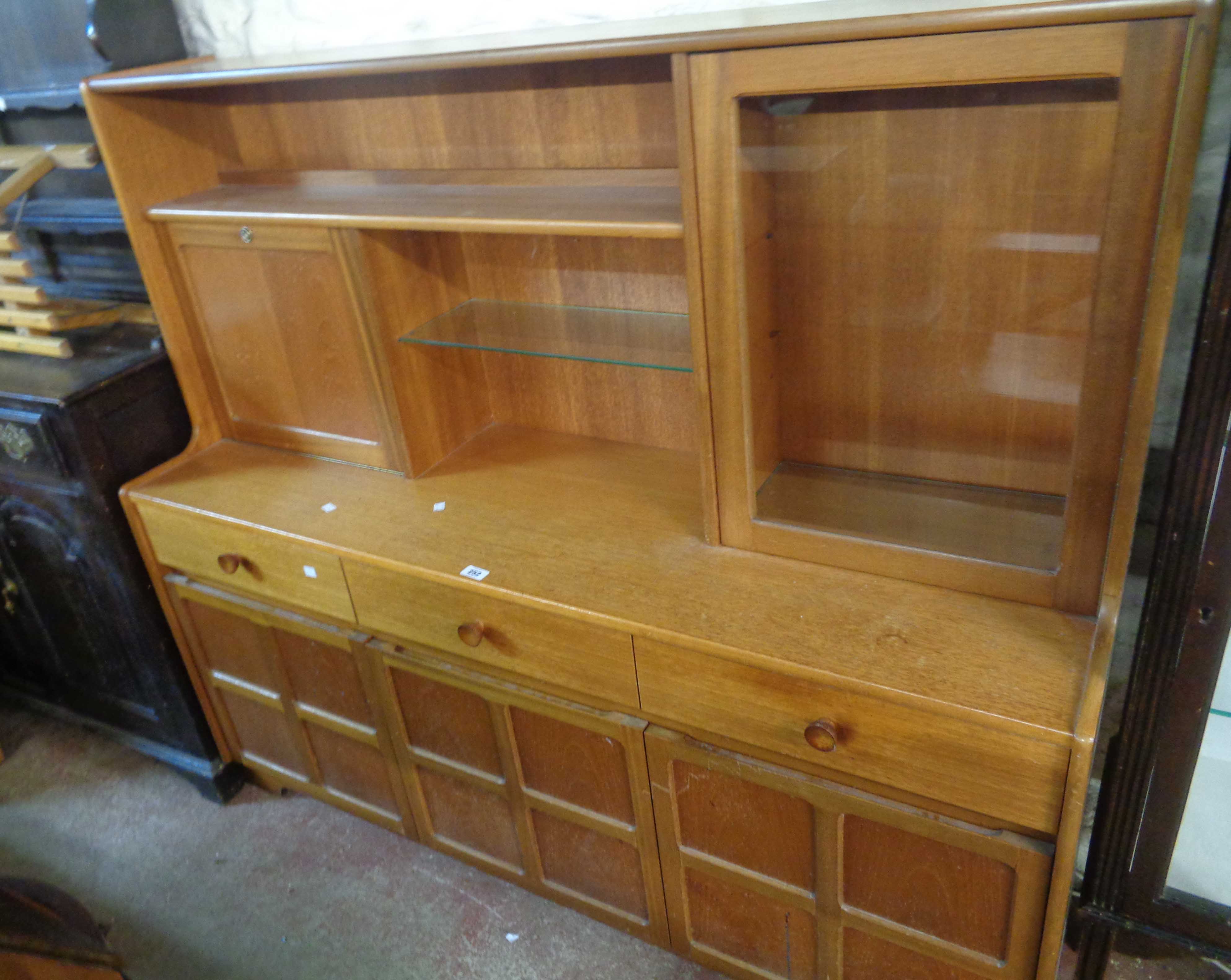 A 1.52m retro Nathan teak effect sideboard with central shelves, fall-front to one side and glazed