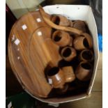 A carved wood Lazy Susan punch bowl set with wooden goblets and ladle