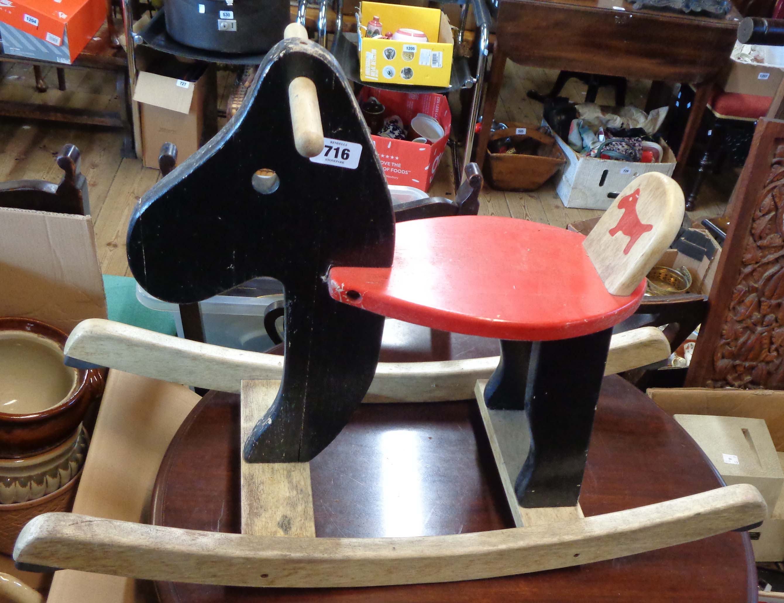 A small painted wood child's rocking horse