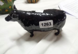 A Beswick Angus cow figurine, model No.1563 with black glaze finish and gold 'Angus Society'