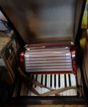 A cased Worldmaster 32 bass accordion