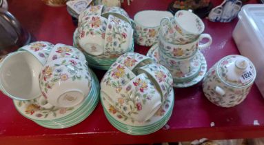 A quantity of Minton bone china teaware decorated in the Haddon Hall pattern including cups and