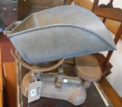 A vintage spring balance - sold with an old set of W.T. Avery shop scales and weights