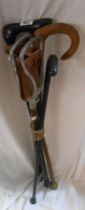 Four vintage wooden walking sticks - sold with a shooting stick