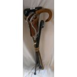 Four vintage wooden walking sticks - sold with a shooting stick