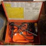 A Spit 325 Electric Masonry drill set within fitted metal case