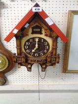 A modern Rhythm wood and plastic cased cuckoo wall clock with battery movement - a/f