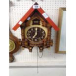 A modern Rhythm wood and plastic cased cuckoo wall clock with battery movement - a/f