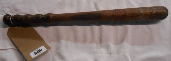 An antique wooden truncheon with painted Royal insignia 'VR 8' - paint worn and chipping to wood