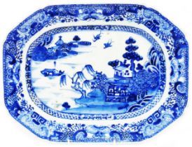 An antique Chinese porcelain meat plate, with blue hand painted Willow pattern decoration