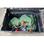 A plastic fishing box/seat containing a quantity of fishing related items including fishing
