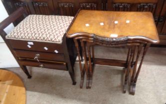 A reproduction walnut nest of three tea tables, set on slender turned supports - sold with a vintage