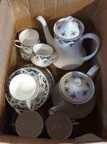 A box containing a quantity of Paragon bone china teaware decorated in the Coniston pattern